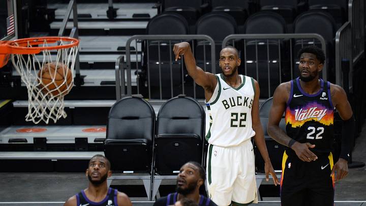 Feb 10, 2021; Phoenix, Arizona, USA; Milwaukee Bucks forward Khris Middleton (22) makes a shot against Phoenix Suns center Deandre Ayton (22) during the second half at Phoenix Suns Arena. Mandatory Credit: Joe Camporeale-USA TODAY Sports Feb 10, 2021; Phoenix, Arizona, USA; Milwaukee Bucks forward Khris Middleton (22) makes a shot against Phoenix Suns center Deandre Ayton (22) during the second half at Phoenix Suns Arena. Mandatory Credit: Joe Camporeale-USA TODAY Sports