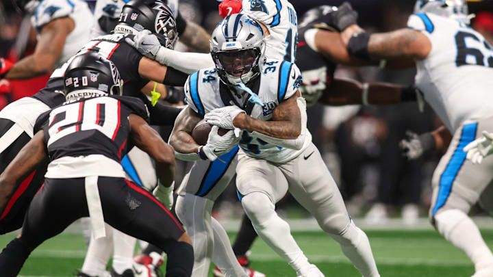 Carolina Panthers running back Mike Boone (34) runs the ball against the Atlanta Falcons in the fourth quarter at Mercedes-Benz Stadium last season. Carolina Panthers running back Mike Boone (34) runs the ball against the Atlanta Falcons in the fourth quarter at Mercedes-Benz Stadium last season.