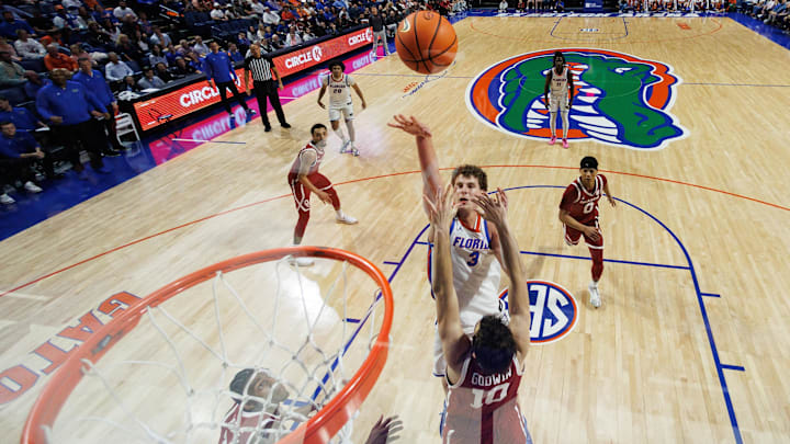 Feb 18, 2025; Gainesville, Florida, USA; Florida Gators center Micah Handlogten (3) shoots over Oklahoma Sooners forward Sam Godwin (10) during the second half at Exactech Arena at the Stephen C. O'Connell Center. Mandatory Credit: Matt Pendleton-Imagn Images