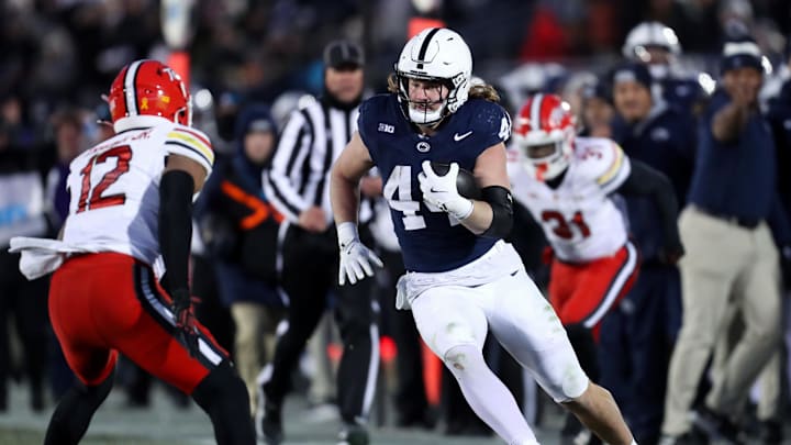 Nov 30, 2024; University Park, Pennsylvania, USA; Penn State Nittany Lions tight end Tyler Warren (44) runs with the ball against the Maryland Terrapins during the second quarter at Beaver Stadium. Mandatory Credit: Matthew O'Haren-Imagn Images