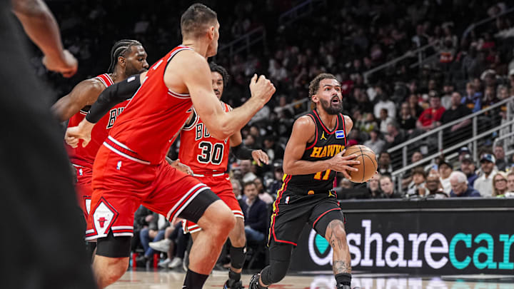 Dec 21, 2025; Atlanta, Georgia, USA; Atlanta Hawks guard Trae Young (11) drives to the basket against the Chicago Bulls during the first half at State Farm Arena. Mandatory Credit: Dale Zanine-Imagn Images