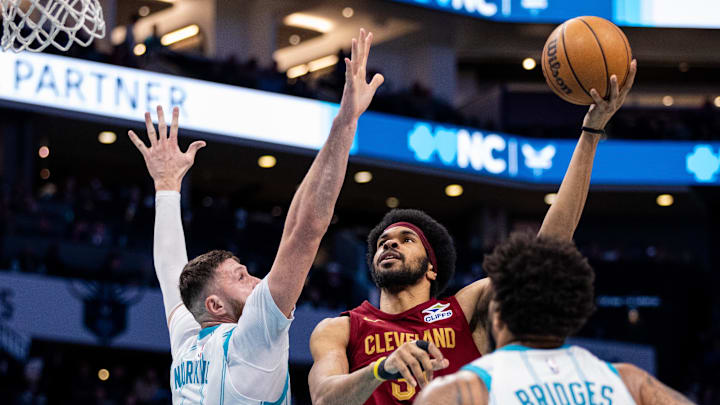 Mar 7, 2025; Charlotte, North Carolina, USA; Cleveland Cavaliers center Jarrett Allen (31) shoots on Charlotte Hornets center Jusuf Nurkic (11) during the third quarter at Spectrum Center. Mandatory Credit: Scott Kinser-Imagn Images