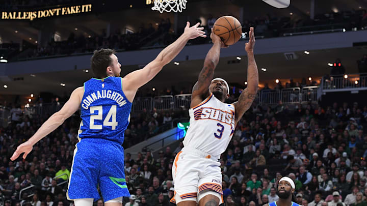 Mar 17, 2024; Milwaukee, Wisconsin, USA; Phoenix Suns guard Bradley Beal (3) drives to the basket against Milwaukee Bucks guard Pat Connaughton (24) in the second half at Fiserv Forum. Mandatory Credit: Michael McLoone-Imagn Images