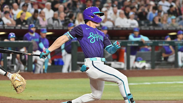 Arizona Diamondbacks outfielder Corbin Carroll (7) doubles in the third inning against the Colorado Rockies at Chase Field on May 16.