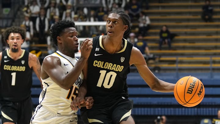 Jan 10, 2024; Berkeley, California, USA; Colorado Buffaloes forward Cody Williams (10) dribbles against California Golden Bears guard Jalen Cone (15) during the first half at Haas Pavilion. Mandatory Credit: Darren Yamashita-USA TODAY Sports