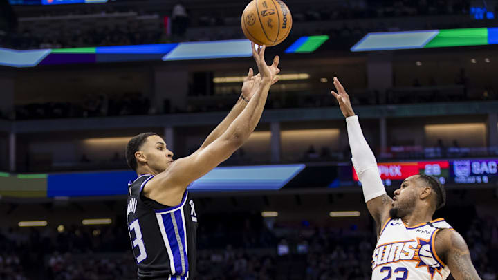 Apr 13, 2025; Sacramento, California, USA; Sacramento Kings forward Keegan Murray (13) takes a three-point shot over Phoenix Suns guard Monte Morris (23) during the second quarter at Golden 1 Center. Mandatory Credit: John Hefti-Imagn Images Apr 13, 2025; Sacramento, California, USA; Sacramento Kings forward Keegan Murray (13) takes a three-point shot over Phoenix Suns guard Monte Morris (23) during the second quarter at Golden 1 Center. Mandatory Credit: John Hefti-Imagn Images