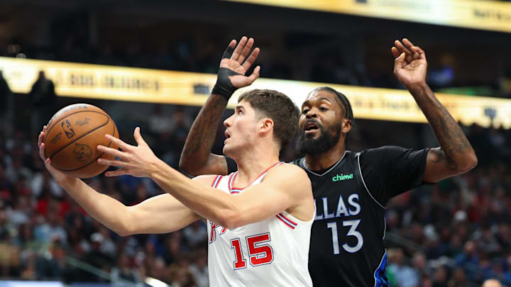 Jan 3, 2026; Dallas, Texas, USA;  Houston Rockets guard Reed Sheppard (15) drives to the basket past Dallas Mavericks forward Naji Marshall (13) during the first quarter at American Airlines Center. Mandatory Credit: Kevin Jairaj-Imagn Images