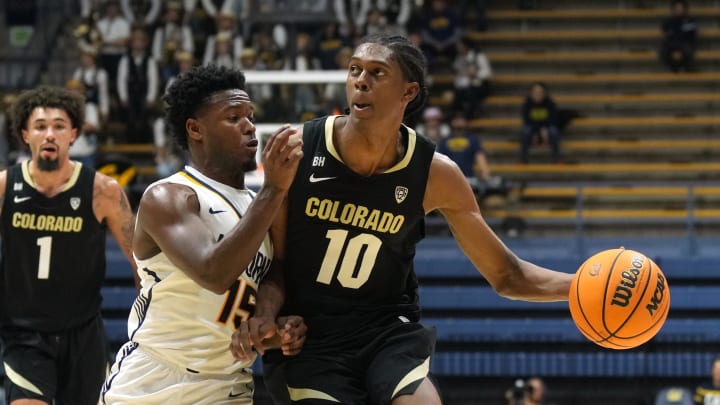Jan 10, 2024; Berkeley, California, USA; Colorado Buffaloes forward Cody Williams (10) dribbles against California Golden Bears guard Jalen Cone (15) during the first half at Haas Pavilion. Mandatory Credit: Darren Yamashita-USA TODAY Sports