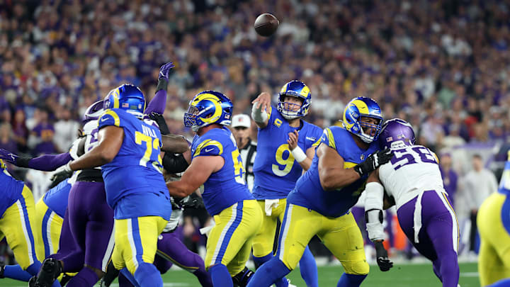 Jan 13, 2025; Glendale, AZ, USA; Los Angeles Rams quarterback Matthew Stafford (9) throws a pass against the Minnesota Vikings during the first half in an NFC wild card game at State Farm Stadium. Mandatory Credit: Mark J. Rebilas-Imagn Images