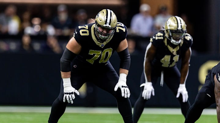 Sep 22, 2024; New Orleans, Louisiana, USA; New Orleans Saints offensive tackle Trevor Penning (70) looks on against the Philadelphia Eagles during the first half at Caesars Superdome. Mandatory Credit: Stephen Lew-Imagn Images