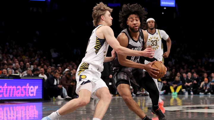 Dec 4, 2024; Brooklyn, New York, USA; Brooklyn Nets forward Trendon Watford (9) drives to the basket against Indiana Pacers forward Johnny Furphy (12) and center Myles Turner (33) during the fourth quarter at Barclays Center. Mandatory Credit: Brad Penner-Imagn Images Dec 4, 2024; Brooklyn, New York, USA; Brooklyn Nets forward Trendon Watford (9) drives to the basket against Indiana Pacers forward Johnny Furphy (12) and center Myles Turner (33) during the fourth quarter at Barclays Center. Mandatory Credit: Brad Penner-Imagn Images
