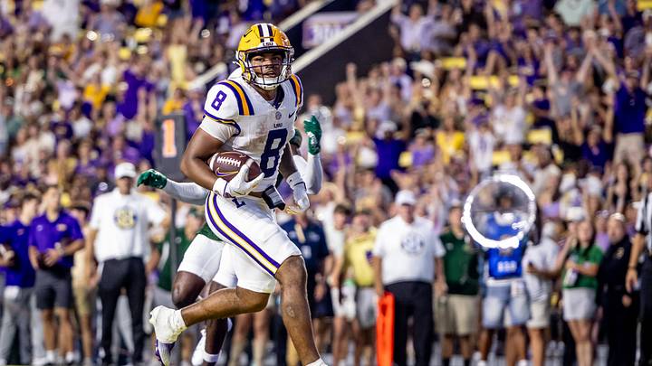 Sep 20, 2025; Baton Rouge, Louisiana, USA; LSU Tigers quarterback Ju’Juan Johnson (8) scores a touchdown against the Southeastern Louisiana Lions during the first half at Tiger Stadium. Mandatory Credit: Stephen Lew-Imagn Images Sep 20, 2025; Baton Rouge, Louisiana, USA; LSU Tigers quarterback Ju’Juan Johnson (8) scores a touchdown against the Southeastern Louisiana Lions during the first half at Tiger Stadium. Mandatory Credit: Stephen Lew-Imagn Images