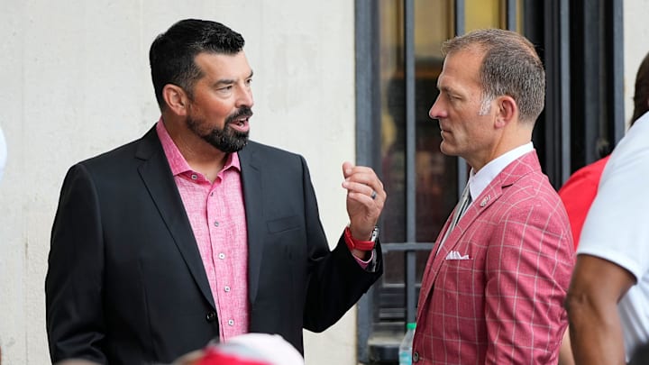 Aug 30, 2024; Columbus, OH, USA; Ohio State Buckeyes head coach Ryan Day and athletic director Ross Bjork attend the unveiling of a statue for former Buckeyes running back Archie Griffin outside Ohio Stadium.