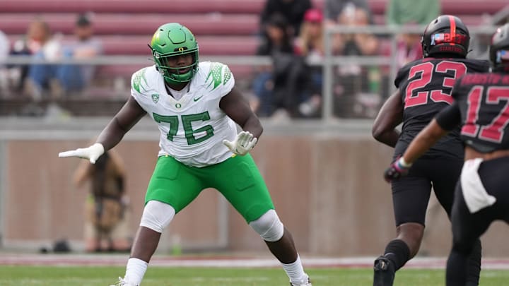 Oregon Ducks offensive lineman Josh Conerly Jr. blocks against Stanford Cardinal linebacker David Bailey.
