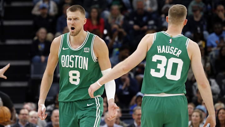 Nov 19, 2023; Memphis, Tennessee, USA; Boston Celtics center Kristaps Porzingis (8) reacts with Boston Celtics forward Sam Hauser (30) during the second half against the Memphis Grizzlies at FedExForum. Mandatory Credit: Petre Thomas-Imagn Images Nov 19, 2023; Memphis, Tennessee, USA; Boston Celtics center Kristaps Porzingis (8) reacts with Boston Celtics forward Sam Hauser (30) during the second half against the Memphis Grizzlies at FedExForum. Mandatory Credit: Petre Thomas-Imagn Images