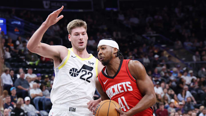 Oct 7, 2024; Salt Lake City, Utah, USA; Houston Rockets guard Nate Hinton (41) goes to the basket against Utah Jazz forward Kyle Filipowski (22) during the fourth quarter at Delta Center. Mandatory Credit: Rob Gray-Imagn Images