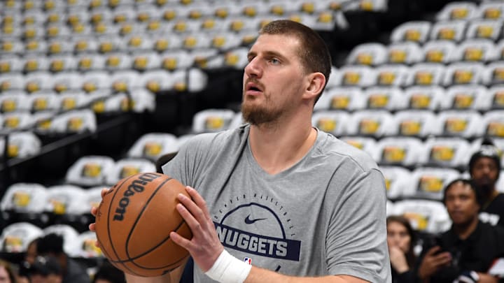 Dec 20, 2025; Denver, Colorado, USA; Denver Nuggets center Nikola Jokic (15) warms up before the game against the Houston Rockets at Ball Arena. Mandatory Credit: Christopher Hanewinckel-Imagn Images