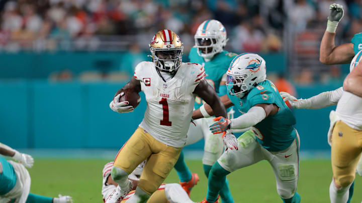 Dec 22, 2024; Miami Gardens, Florida, USA; San Francisco 49ers wide receiver Deebo Samuel Sr. (1) runs with the football past Miami Dolphins linebacker Anthony Walker Jr. (6) during the fourth quarter at Hard Rock Stadium. Mandatory Credit: Sam Navarro-Imagn Images Dec 22, 2024; Miami Gardens, Florida, USA; San Francisco 49ers wide receiver Deebo Samuel Sr. (1) runs with the football past Miami Dolphins linebacker Anthony Walker Jr. (6) during the fourth quarter at Hard Rock Stadium. Mandatory Credit: Sam Navarro-Imagn Images
