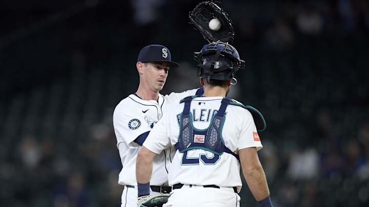 Seattle Mariners starting pitcher Emerson Hancock (left) talks with catcher Cal Raleigh during a game against the Detroit Tigers on March 31 at T-Mobile Park. Seattle Mariners starting pitcher Emerson Hancock (left) talks with catcher Cal Raleigh during a game against the Detroit Tigers on March 31 at T-Mobile Park.