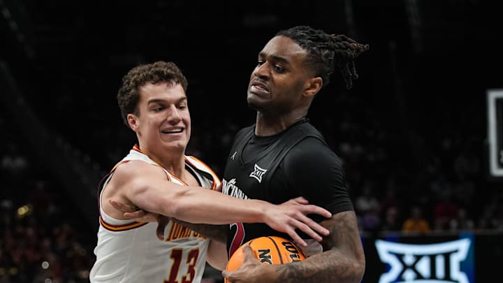 Bearcats Jizzle James (2) pushes through the defense during Game 2 of the 2025 Phillips 66 Big 12 Basketball Championship against the Iowa State Cyclones at the T-Mobile Center in Kansas City, Missouri on Wednesday March 12, 2025. Cyclones won the game with a final score of 76-56.