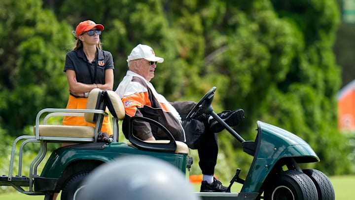 Bengals owner Mike Brown stands with his grand daughter Elizabeth Blackburn on the sideline during a preseason joint practice at the Paycor Stadium practice facility in downtown Cincinnati on Tuesday, Aug. 20, 2024. Bengals owner Mike Brown stands with his grand daughter Elizabeth Blackburn on the sideline during a preseason joint practice at the Paycor Stadium practice facility in downtown Cincinnati on Tuesday, Aug. 20, 2024.