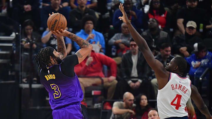 Jan 19, 2025; Inglewood, California, USA; Los Angeles Lakers forward Anthony Davis (3) shoots against Los Angeles Clippers center Mo Bamba (4) during the first half at Intuit Dome. Mandatory Credit: Gary A. Vasquez-Imagn Images