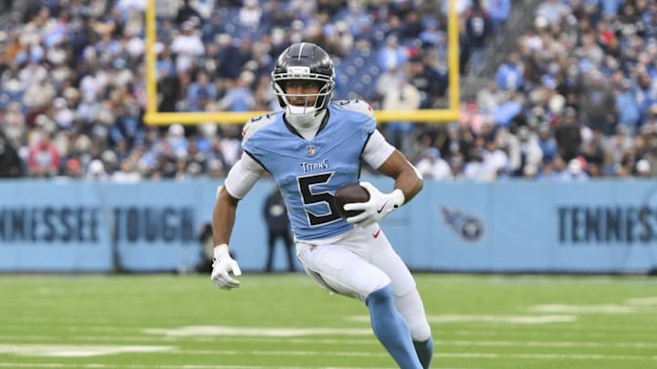 Nov 2, 2025; Nashville, Tennessee, USA; Tennessee Titans wide receiver Elic Ayomanor (5) runs the ball after a catch against the Los Angeles Chargers during the third quarter at Nissan Stadium. Mandatory Credit: Steve Roberts-Imagn Images