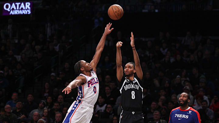 Jan 4, 2025; Brooklyn, New York, USA; Brooklyn Nets forward Ziaire Williams (8) shoots the ball asPhiladelphia 76ers guard Tyrese Maxey (0) defends during the second half at Barclays Center. Mandatory Credit: Vincent Carchietta-Imagn Images