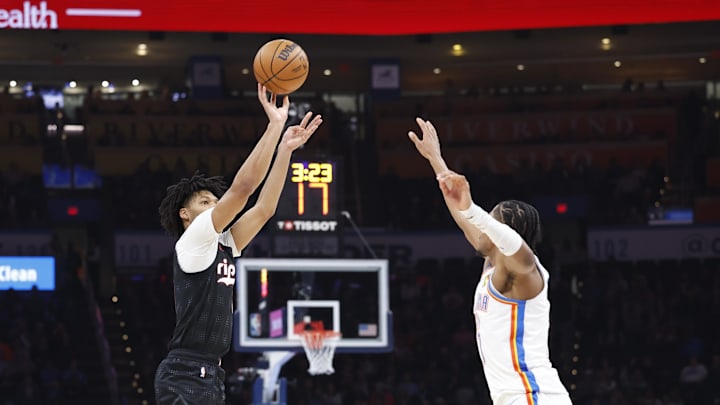 Nov 20, 2024; Oklahoma City, Oklahoma, USA; Portland Trail Blazers guard Shaedon Sharpe (17) shoots a three point basket over Oklahoma City Thunder forward Jalen Williams (8) during the second quarter at Paycom Center. Mandatory Credit: Alonzo Adams-Imagn Images