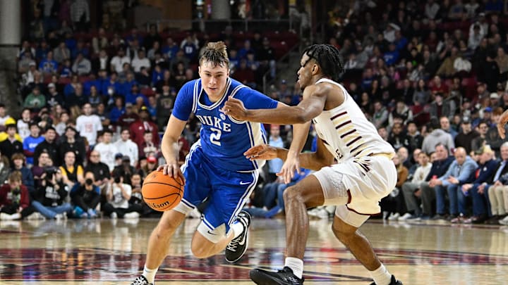 Jan 18, 2025; Chestnut Hill, Massachusetts, USA; Duke Blue Devils guard Cooper Flagg (2) dribbles the ball against Boston College Eagles guard Donald Hand Jr. (13) during the second half at Conte Forum. Mandatory Credit: Eric Canha-Imagn Images Jan 18, 2025; Chestnut Hill, Massachusetts, USA; Duke Blue Devils guard Cooper Flagg (2) dribbles the ball against Boston College Eagles guard Donald Hand Jr. (13) during the second half at Conte Forum. Mandatory Credit: Eric Canha-Imagn Images