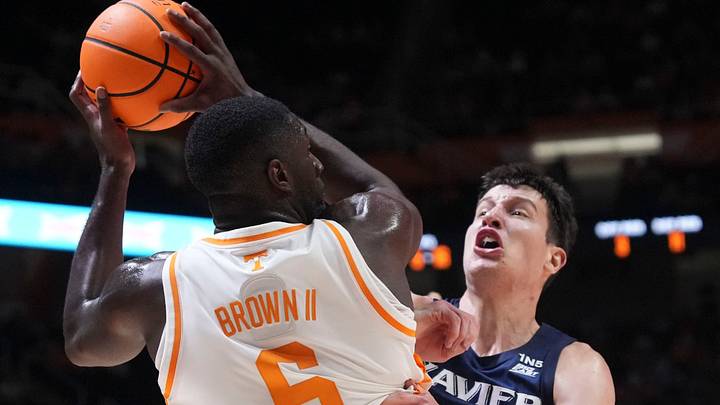 Tennessee forward DeWayne Brown II (6) looks to move the ball while guarded by Xavier forward Filip Borovicanin during a college basketball exhibition game on Oct. 15, 2026, in Knoxville, Tennessee. Tennessee forward DeWayne Brown II (6) looks to move the ball while guarded by Xavier forward Filip Borovicanin during a college basketball exhibition game on Oct. 15, 2026, in Knoxville, Tennessee.