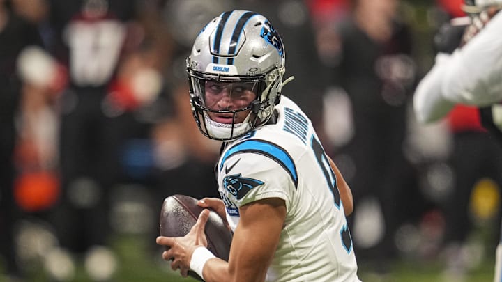 Jan 5, 2025; Atlanta, Georgia, USA; Carolina Panthers quarterback Bryce Young (9) rolls out to pass against the Atlanta Falcons during the first quarter at Mercedes-Benz Stadium. Mandatory Credit: Dale Zanine-Imagn Images