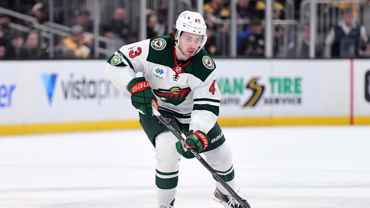 Mar 28, 2026; Boston, Massachusetts, USA; Minnesota Wild defenseman Quinn Hughes (43) skates with the puck during the second period against the Boston Bruins at TD Garden. Mandatory Credit: Bob DeChiara-Imagn Images