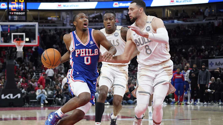 Jan 25, 2025; Chicago, Illinois, USA; Chicago Bulls guard Zach LaVine (8) defends Philadelphia 76ers guard Tyrese Maxey (0) during the second half at United Center. Mandatory Credit: David Banks-Imagn Images