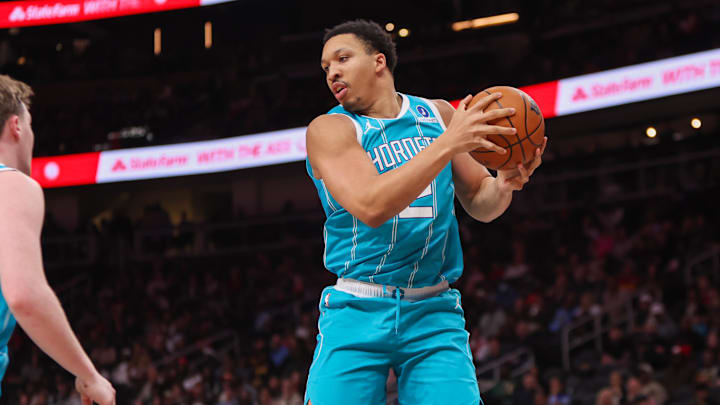 Feb 7, 2026; Atlanta, Georgia, USA; Charlotte Hornets forward Grant Williams (2) grabs a rebound against the Atlanta Hawks in the second quarter at State Farm Arena. Mandatory Credit: Brett Davis-Imagn Images