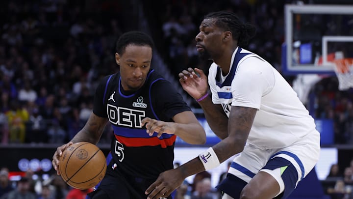 Apr 02, 2026; Detroit, Michigan, USA; Detroit Pistons forward Ronald Holland II (5) dribbles defended by Minnesota Timberwolves center Naz Reid (11) in the first half at Little Caesars Arena. Mandatory Credit: Rick Osentoski-Imagn Images