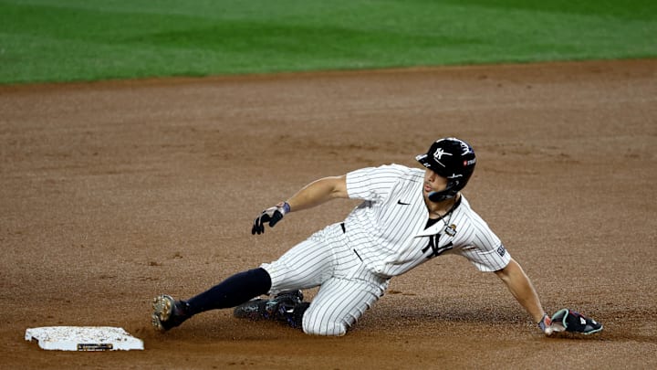 New York Yankees designated hitter Giancarlo Stanton (27) doubles during the fourth inning against the Los Angeles Dodgers in game three of the 2024 MLB World Series at Yankee Stadium in 2024.