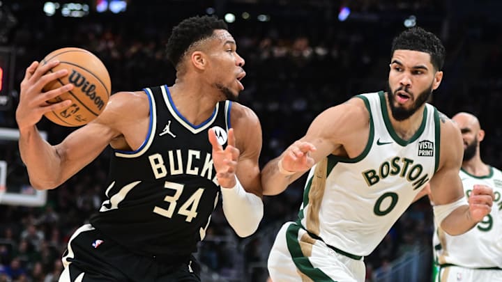 Milwaukee Bucks forward Giannis Antetokounmpo (34) drives for the basket against Boston Celtics forward Jayson Tatum.