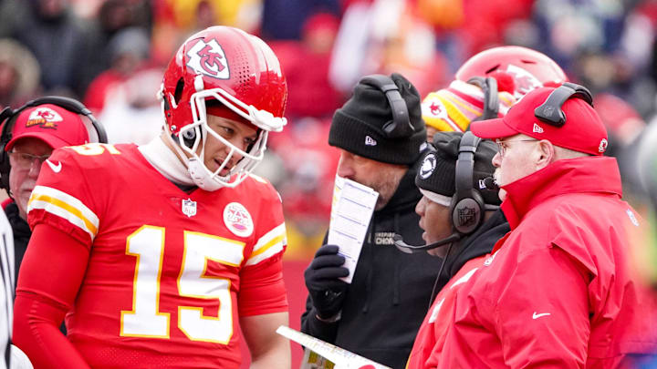 Dec 24, 2022; Kansas City, Missouri, USA; Kansas City Chiefs head coach Andy Reid talks with offensive coordinator Eric Bieniemy and head coach Andy Reid against the Seattle Seahawks during the second half at GEHA Field at Arrowhead Stadium. Mandatory Credit: Denny Medley-Imagn Images