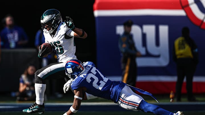 Oct 20, 2024; East Rutherford, New Jersey, USA; Philadelphia Eagles running back Saquon Barkley (26) carries the ball as New York Giants safety Jason Pinnock (27) pursues during the second half at MetLife Stadium. Mandatory Credit: Vincent Carchietta-Imagn Images Oct 20, 2024; East Rutherford, New Jersey, USA; Philadelphia Eagles running back Saquon Barkley (26) carries the ball as New York Giants safety Jason Pinnock (27) pursues during the second half at MetLife Stadium. Mandatory Credit: Vincent Carchietta-Imagn Images