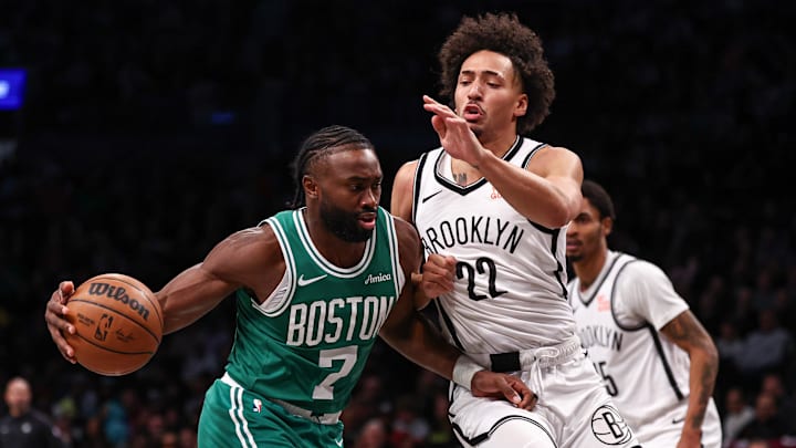 Nov 13, 2024; Brooklyn, New York, USA; Boston Celtics guard Jaylen Brown (7) drives to the basket as Brooklyn Nets forward Jalen Wilson (22) defends during the first half at Barclays Center. Mandatory Credit: Vincent Carchietta-Imagn Images