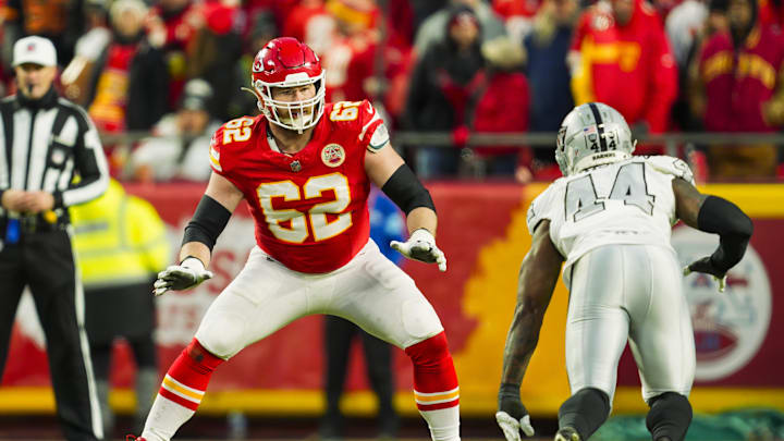 Nov 29, 2024; Kansas City, Missouri, USA; Kansas City Chiefs guard Joe Thuney (62) looks to block against Las Vegas Raiders defensive end K'Lavon Chaisson (44) during the second half at GEHA Field at Arrowhead Stadium. Mandatory Credit: Jay Biggerstaff-Imagn Images