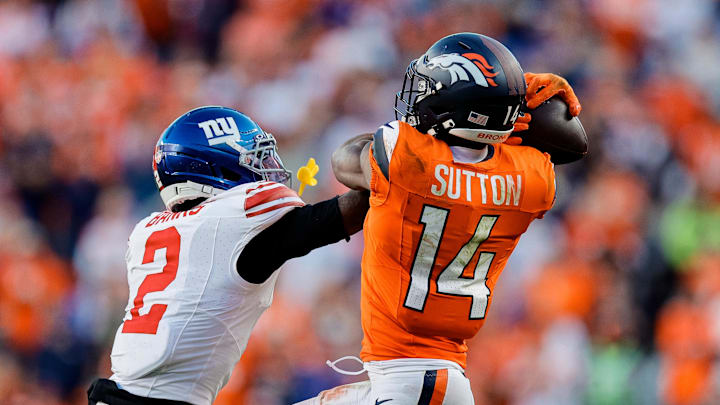 Oct 19, 2025; Denver, Colorado, USA; Denver Broncos wide receiver Courtland Sutton (14) pulls in a pass under pressure from New York Giants cornerback Deonte Banks (2) in the fourth quarter at Empower Field at Mile High. Mandatory Credit: Isaiah J. Downing-Imagn Images Oct 19, 2025; Denver, Colorado, USA; Denver Broncos wide receiver Courtland Sutton (14) pulls in a pass under pressure from New York Giants cornerback Deonte Banks (2) in the fourth quarter at Empower Field at Mile High. Mandatory Credit: Isaiah J. Downing-Imagn Images