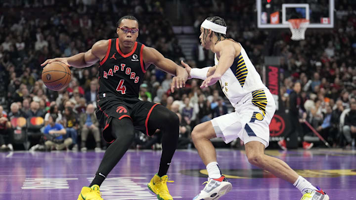 Dec 3, 2024; Toronto, Ontario, CAN; Toronto Raptors forward Scottie Barnes (4) tries to dribble around Indiana Pacers guard Andrew Nembhard (2) during the first half at Scotiabank Arena. Mandatory Credit: John E. Sokolowski-Imagn Images