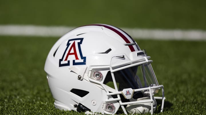 Nov 25, 2022; Tucson, Arizona, USA; Detailed view of an Arizona Wildcats helmet on the field during the Territorial Cup at Arizona Stadium. Mandatory Credit: Mark J. Rebilas-Imagn Images Nov 25, 2022; Tucson, Arizona, USA; Detailed view of an Arizona Wildcats helmet on the field during the Territorial Cup at Arizona Stadium. Mandatory Credit: Mark J. Rebilas-Imagn Images