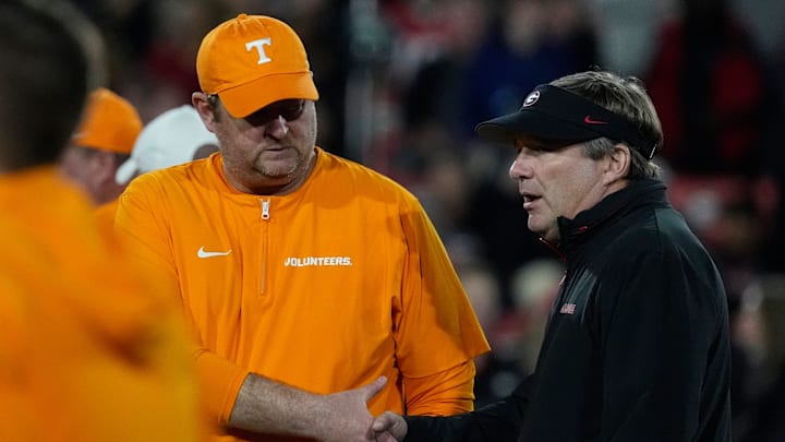 Tennessee head coach Josh Heupel shanks hands with Georgia head coach Kirby Smart before the start of a NCAA college football game against Tennessee in Athens, Ga., on Saturday, Nov. 16, 2024.