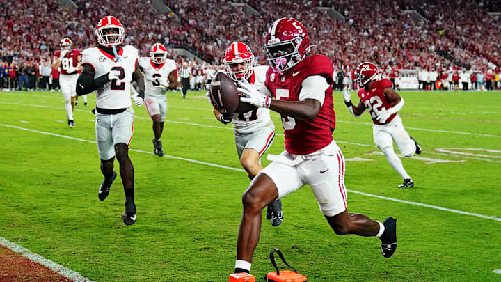 Sep 28, 2024; Tuscaloosa, Alabama, USA; Alabama Crimson Tide wide receiver Germie Bernard (5) score a touchdown during the first quarter against the Georgia Bulldogs at Bryant-Denny Stadium. Mandatory Credit: John David Mercer-Imagn Images