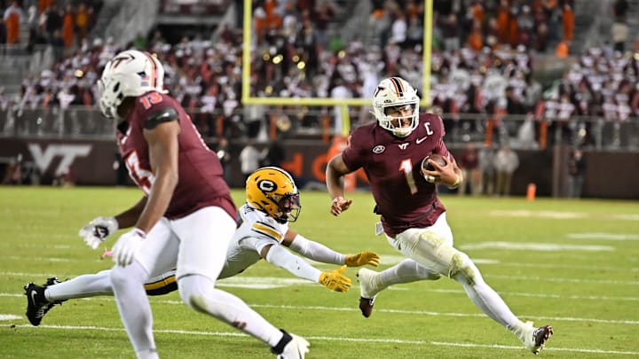 Oct 24, 2025; Blacksburg, Virginia, USA; Virginia Tech Hokies quarterback Kyron Drones (1) runs the ball as California Golden Bears defensive back Jordan Sanford (17) dives to tackle him during the fourth quarter Lane Stadium. Mandatory Credit: Brian Bishop-Imagn Images Oct 24, 2025; Blacksburg, Virginia, USA; Virginia Tech Hokies quarterback Kyron Drones (1) runs the ball as California Golden Bears defensive back Jordan Sanford (17) dives to tackle him during the fourth quarter Lane Stadium. Mandatory Credit: Brian Bishop-Imagn Images