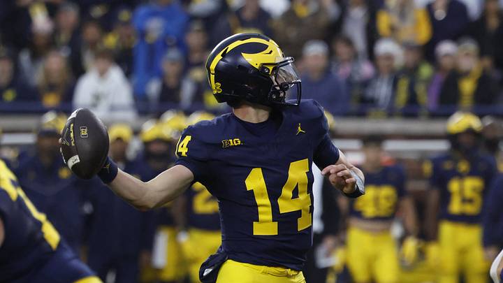 Sep 19, 2026; Ann Arbor, Michigan, USA;  Michigan Wolverines quarterback Tommy Carr (14) makes a throw against the Texas El Paso Miners during the fourth quarter at Michigan Stadium.  Mandatory Credit: Rick Osentoski-Imagn Images