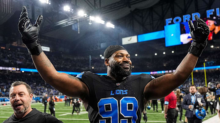 Detroit Lions defensive end Za'Darius Smith (99) celebrates 31-9 win over Minnesota Vikings as he exits the field at Ford Field in Detroit on Sunday, Jan. 5, 2025.